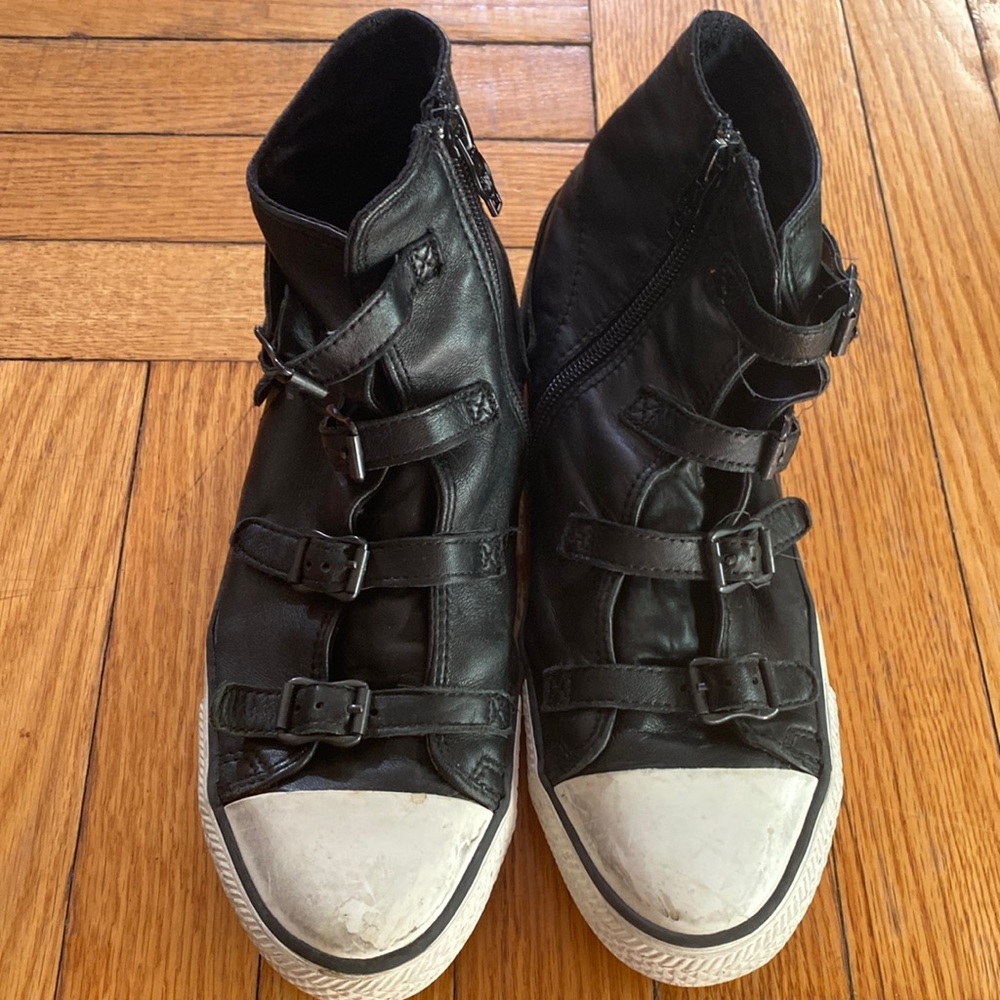 Ash black leather fashion sneaker. zips on side with functional buckles.